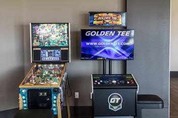 Open air game room with golden tee golf video game, billiards, and much more